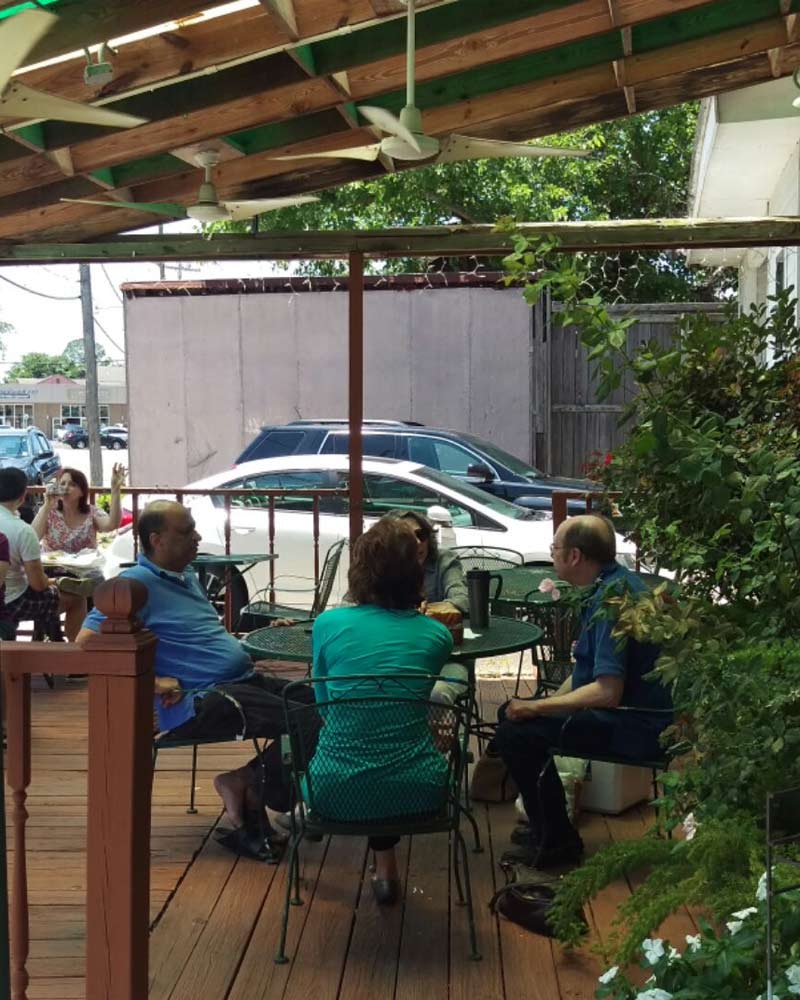 A cartoon owl holding a cell phone.