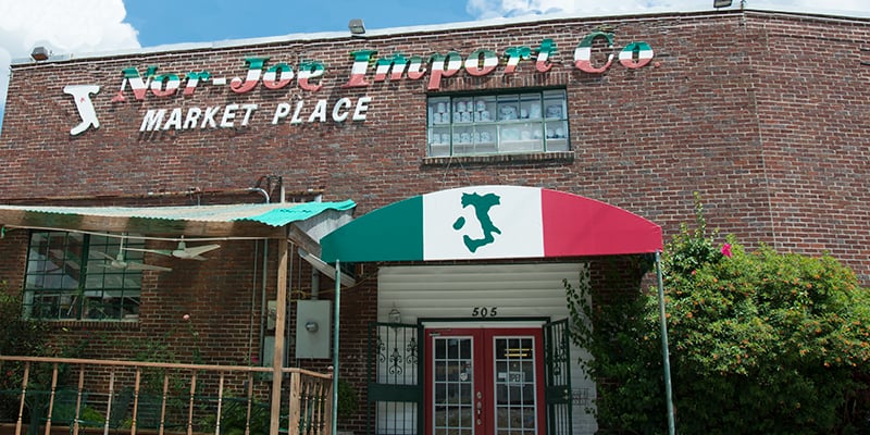 A cartoon owl holding a cell phone.