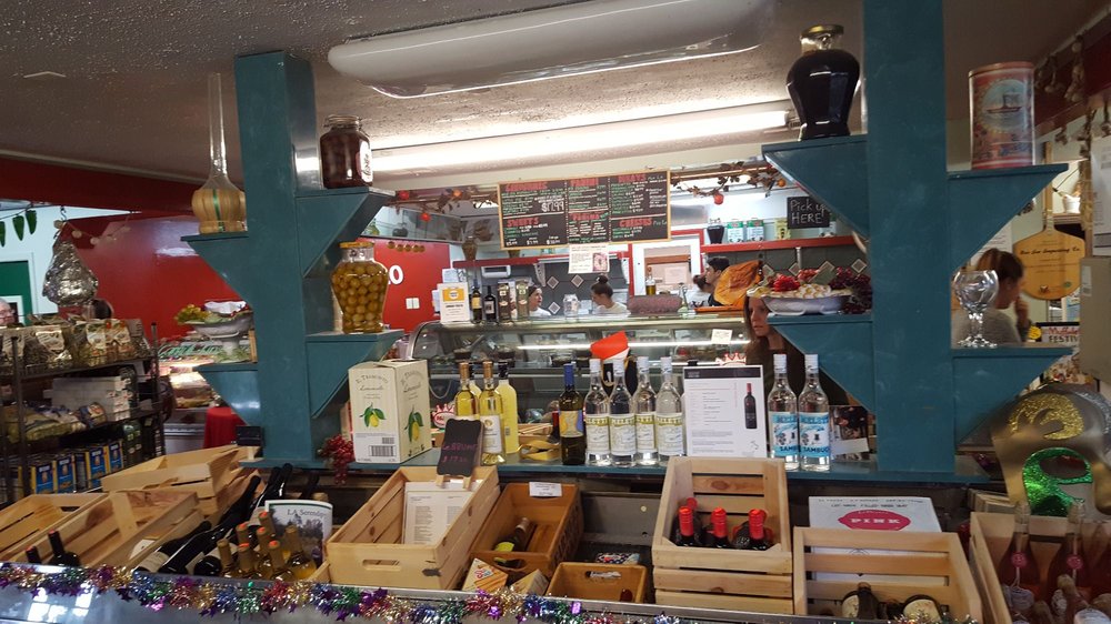 A cartoon owl holding a cell phone.