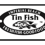 A cartoon owl holding a cell phone.